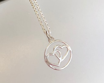 Twin hearts necklace, double heart pendant, two hearts in circle, sterling silver heart necklace, circle heart mom necklace, couple necklace