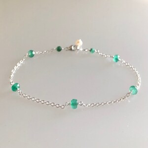 Long Leather Bracelet Featuring Genuine Emerald Faceted Stones and Tahitian Pearl Clasp to Wrap Three Time Around The Wrist.