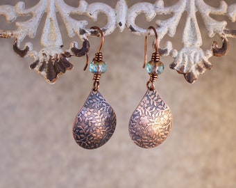 Embossed Floral Copper Teardrops Wire Wrapped in Antique Copper and hung from Antique Copper French Ear Wires beaded with a Mint Chrystal