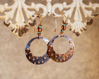 Embossed Copper Hoops hang from handmade Antique Copper French Ear Wires beaded in Turquoise and Copper