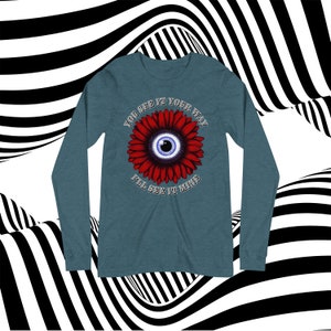 May include: A teal blue long-sleeve shirt with a red flower graphic. The flower has a blue eye in the center and the text "You see it your way I'll see it mine".