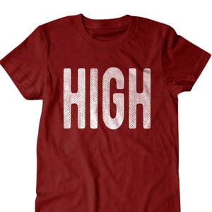 May include: A red t-shirt with the word "HIGH" printed in white on the front.