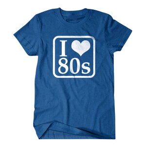 May include: A royal blue t-shirt with a white square graphic that says "I love 80s" with a white heart in the middle of the "I".