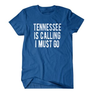 May include: A royal blue t-shirt with the text "Tennessee is calling I must go" in white.