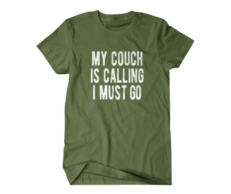 May include: A green t-shirt with the text "My couch is calling I must go" printed in white.