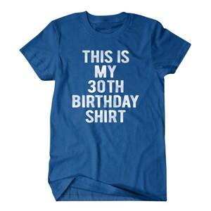 Puede incluir: Una camiseta azul real con el texto "This is my 30th Birthday Shirt" en blanco.