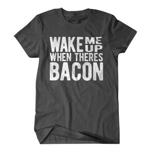May include: Dark gray t-shirt with white text that reads "Wake me up when there's bacon".
