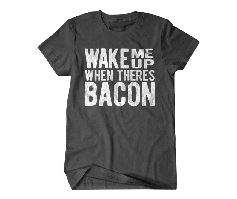 May include: Dark gray t-shirt with white text that reads "Wake me up when there's bacon".