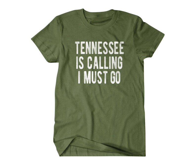 May include: A green t-shirt with the text "Tennessee is calling I must go" printed in white.