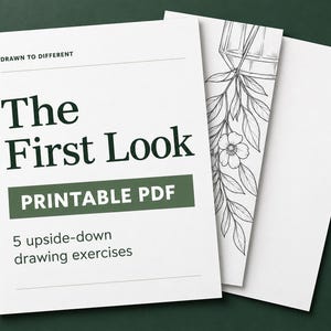 May include: A white printable PDF document titled The First Look with the text Drawn to Different and 5 upside-down drawing exercises. The cover features a black and white line art illustration of a hanging plant in a geometric glass container.