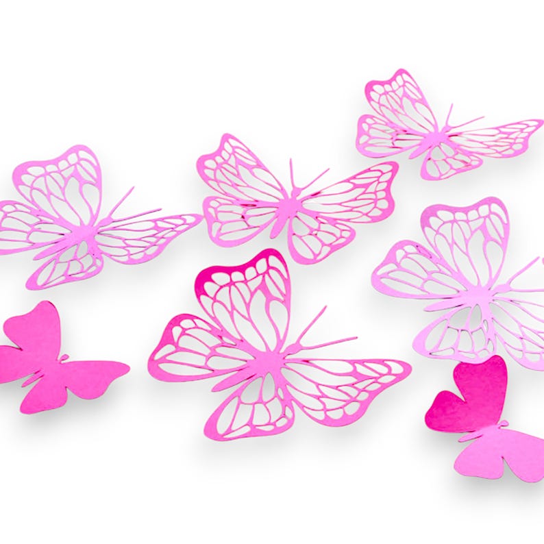 May include: A set of six pink butterfly wall decals. The butterflies are made of a thin, metallic material and have a delicate, lacy design.