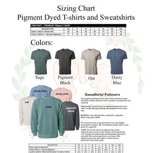 May include: Sizing chart for pigment dyed t-shirts and sweatshirts in various colors, including sage, pigment black, oat, and dusty blue. The chart shows measurements for body length, chest width, and sleeve length in inches. The chart also includes information about the fabric composition and care instructions.