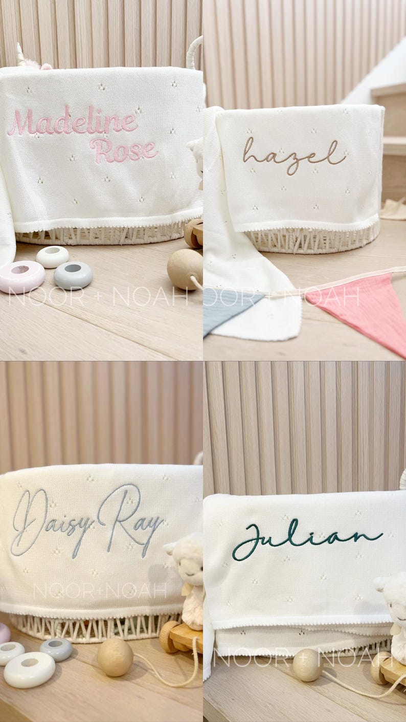 May include: White baby blankets with embroidered names: "Madeline Rose", "Hazel", "Daisy Ray", and "Julian". Each blanket is displayed in a white wicker basket. The names are in pink, brown, gray, and green script.