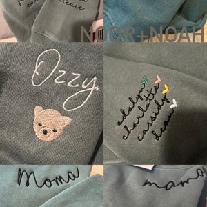 May include: A collage of six images showing different embroidered sweatshirts. The sweatshirts are all a light blue-green color. The embroidery includes names, words, and small designs like a bear, a heart, and a rainbow. The text on the sweatshirts includes: "Shane, Autumn, Shannon, Brandon, Jennifer, Caleb, Lynn, Barbara, Debra, Steure, Sadie, Noor + Noah, Ozzy, Adalyn, Charlotte, Cassidy, Dean, Moma, Esteban, Luis, Emil, Millie, Mama, J".