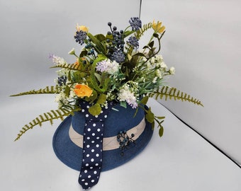 masculine decor, blue and yellow flowers, unique floral arrangement, hostess gift, barber shop decor, fedora hat and tie, mantle decor