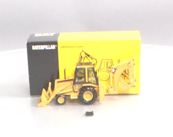 Retroexcavadora NZG Norscot 2851 Cat 428B, escala 1:50, fabricada en Alemania.