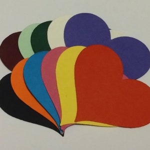 May include: A set of ten felt heart shapes in various colours, including black, orange, blue, pink, yellow, red, purple, green, white and maroon.