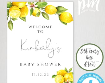 May include: A printable welcome sign for a baby shower with a lemon theme. The sign is white with black text that reads "Welcome to Kimberly's Baby Shower 11.12.22". The sign is decorated with watercolor illustrations of lemons and leaves.