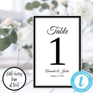 May include: Black and white printable table number card with the text "Table 1" and the names "Amanda & Justin" and the date "August 12, 2022".