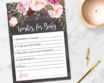 Può includere: Una carta di gioco per baby shower stampabile con un design floreale su uno sfondo di legno. La carta ha il testo "Wishes for Baby" e include un elenco di suggerimenti per gli ospiti per scrivere gli auguri per il nuovo bambino.