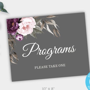 May include: A printable wedding sign with a gray background and floral design. The sign says "Programs" and "Please Take One". The sign is 10 inches by 8 inches.