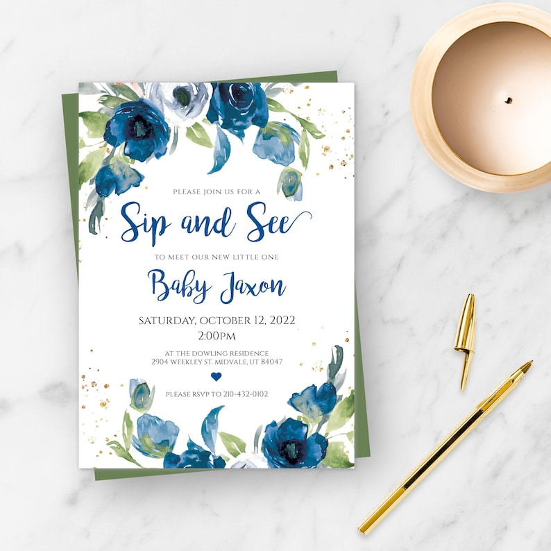 May include: A blue and green watercolor floral baby shower invitation with gold glitter accents. The invitation reads "Sip and See" to meet our new little one "Baby Jaxon" on Saturday, October 12, 2022 at 2:00 PM at the Dowling Residence, 2904 Weekley St. Midvale, UT 84047. Please RSVP to 210-432-0102.