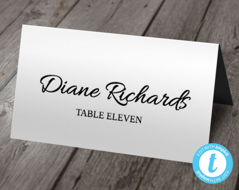 May include: White place card with black text. The text reads "Diane Richards" and "Table Eleven".