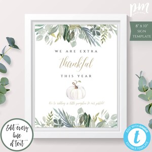 May include: Printable 8x10 inch sign template with a white background and green watercolor leaves. The text reads "We are extra thankful this year. We're adding a little pumpkin to our patch!"