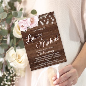 May include: A wedding program with a rustic wood-grain design. The program features the names "Lauren & Michael" and the date "Saturday, August 12, 2020." Pink floral accents and string lights adorn the top. The ceremony details are listed below.