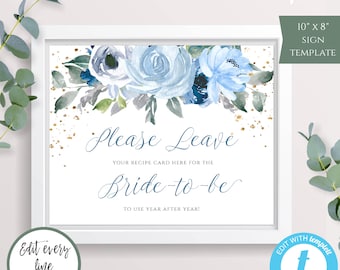 May include: A printable 10x8 inch sign template with a blue and gold floral design. The text on the sign reads "Please Leave Your Recipe Card Here For The Bride-To-Be To Use Year After Year!"