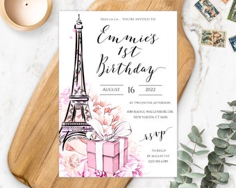 May include: A pink and white birthday invitation with a watercolor illustration of the Eiffel Tower and pink flowers. The text reads "Ooh la la... You're invited to Emmie's 1st Birthday" and includes the date August 16, 2022.
