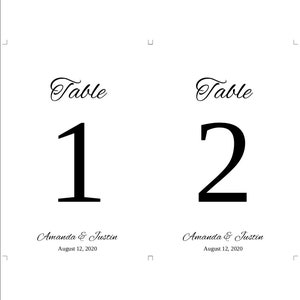 May include: Two black and white table number cards with the text "Table" and the numbers "1" and "2" in large font. The text "Amanda & Justin" and the date "August 12, 2020" are printed below each number.