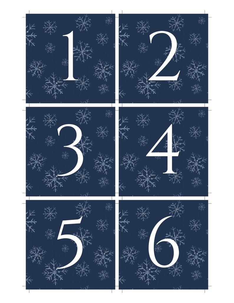May include: Six blue square cards with white snowflake patterns. Each card has a white number, 1 through 6, in the center.