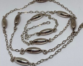 A Lovely 32” Sterling Silver Fancy Link Polished Silver Bead Necklace