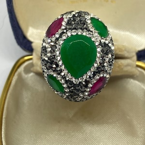 May include: A set of three ceramic mugs with a speckled, matte finish. The mugs are in shades of cream, light gray, and dark gray. Each mug has a simple, minimalist design, perfect for coffee or tea.