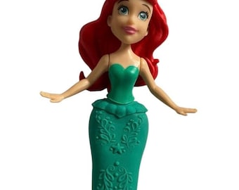 Muñeca Polly Pocket con clip mágico de la princesa Disney Sirenita Ariel