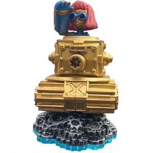May include: A gold toy tank with a figure on top. The figure has pink hair, blue sunglasses, and a blue arm. The tank sits on a gray and blue base. The toy is a collectible item.