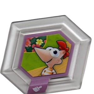 May include: A clear, hexagonal game piece featuring a cartoon character with a large nose, red hair, and an orange and white striped shirt. The character is set against a green and floral background. A purple border surrounds the character.