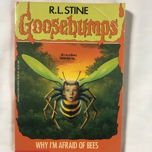 May include: A Goosebumps book cover featuring a yellow and black bee with a human face and wings. The book title is "Why I'm Afraid of Bees" and the author is R.L. Stine.
