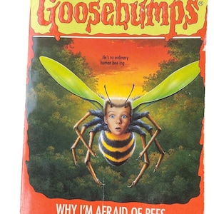May include: A vintage Goosebumps book cover. The image shows a bee-human hybrid with a shocked expression. The title is "Why I'm Afraid of Bees" by R.L. Stine. The cover has a green and yellow color scheme, with the Scholastic logo at the bottom.