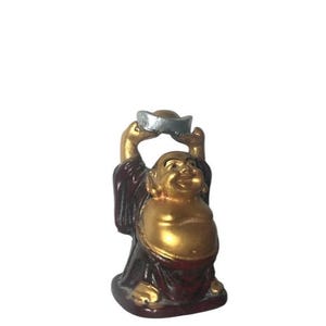Vintage Happy Laughing Buddha , Red Resin With Gold Tone Figure Arms Up