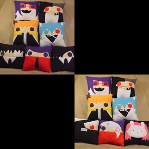 May include: A set of 10 colourful plush pillows featuring different cartoon characters. The pillows are made of soft fabric and have a variety of expressions.