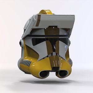 May include: A yellow and white clone trooper helmet with a brown visor and a black stripe on the side. The helmet has a yellow and blue stripe on the back.
