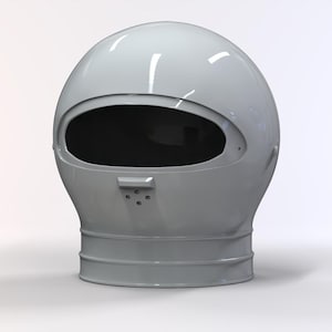 Puede incluir: Un casco gris claro de aspecto futurista, con una gran abertura de visera ovalada. El casco tiene un acabado liso y brillante y una base cilíndrica. El diseño sugiere un tema espacial o de ciencia ficción.