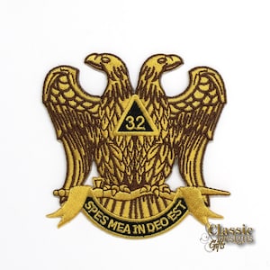 May include: Gold embroidered patch with two brown eagles facing each other, a black triangle with the number 32 inside, and a banner with the text "SPES MEA IN DEO EST".