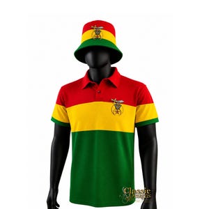 May include: A bucket hat and a short-sleeved polo shirt featuring a horizontal tricolour pattern of red, yellow, and green. Both items display a metallic emblem featuring a sword and a star. The shirt has a collar with buttons at the neckline.