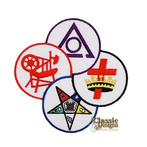 May include: Four embroidered patches with Masonic symbols. The patches are white with colored embroidery. The symbols include a compass and square, a triangle with a circle inside, a cross with a crown, and a five-pointed star.