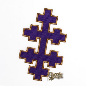May include: Purple embroidered patch with a gold outline in the shape of a cross with four arms. The cross is a traditional symbol of the Orthodox Church.