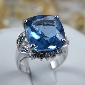 Dazzling intense Swiss Blue Topaz Main Stone 12..5mm x 13.7mm. SAPP 925 Silver Ring.  Size 7