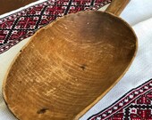 Vintage huge wooden flour scoop. Kitchen in a country house. Rural primitive wooden kitchen. Collectable wooden gadgets. Tools.
